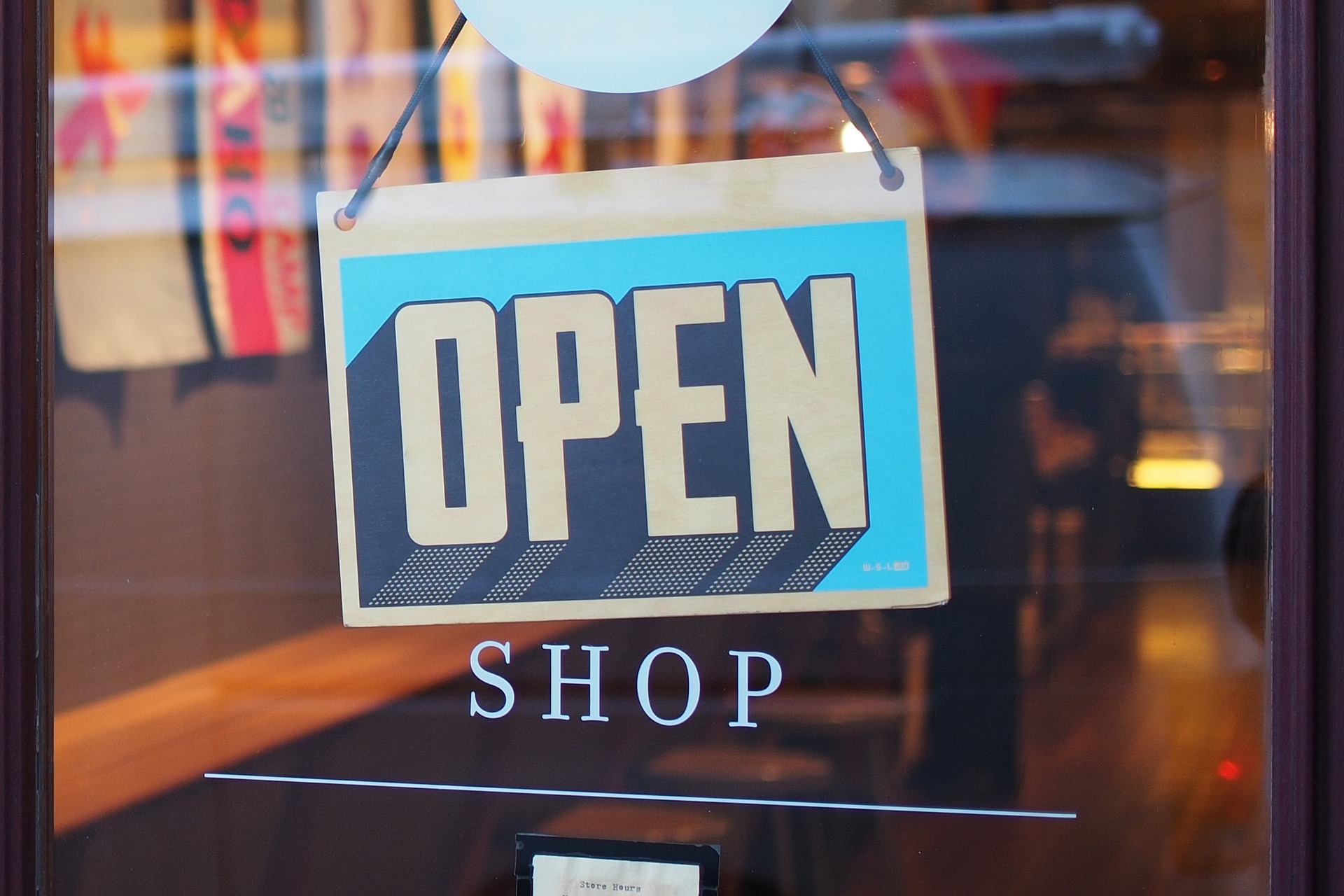 an image of a shop sign saying open