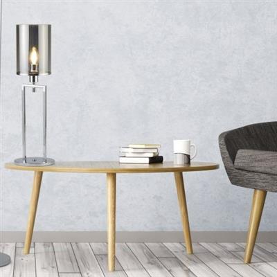 image of a chrome table lamp on a wooden side table